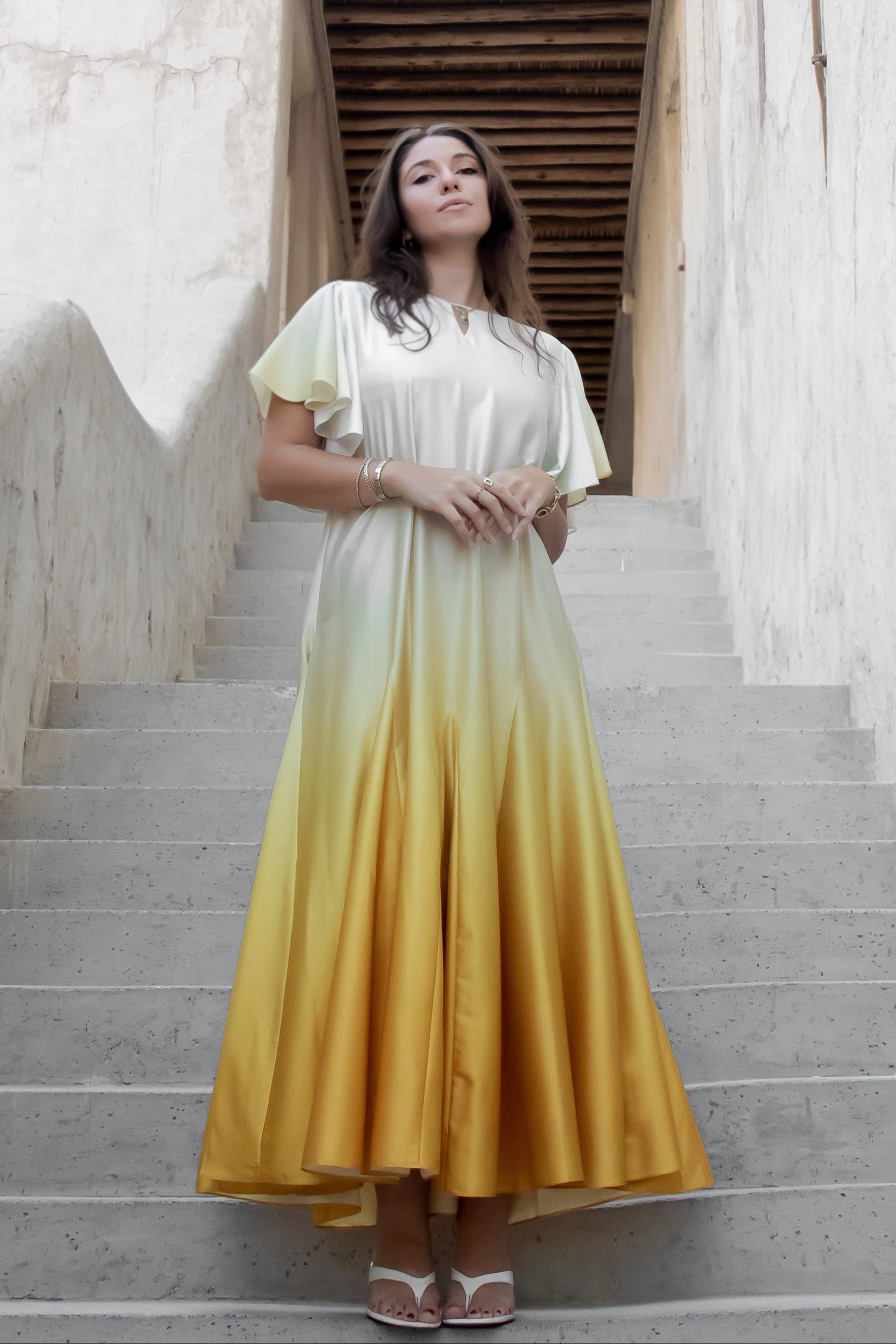 Yellow ombré Nourah Dress by Kunst featuring graceful flowing fabric and elegant flared shape for daytime celebrations
