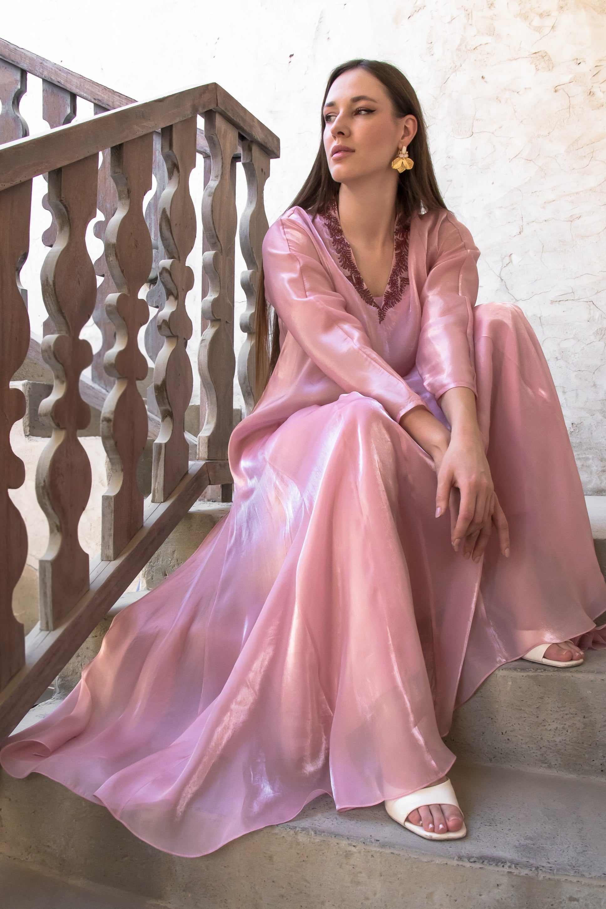 Melure dress in soft blush organza with gentle draped flare and refined bead detailing
