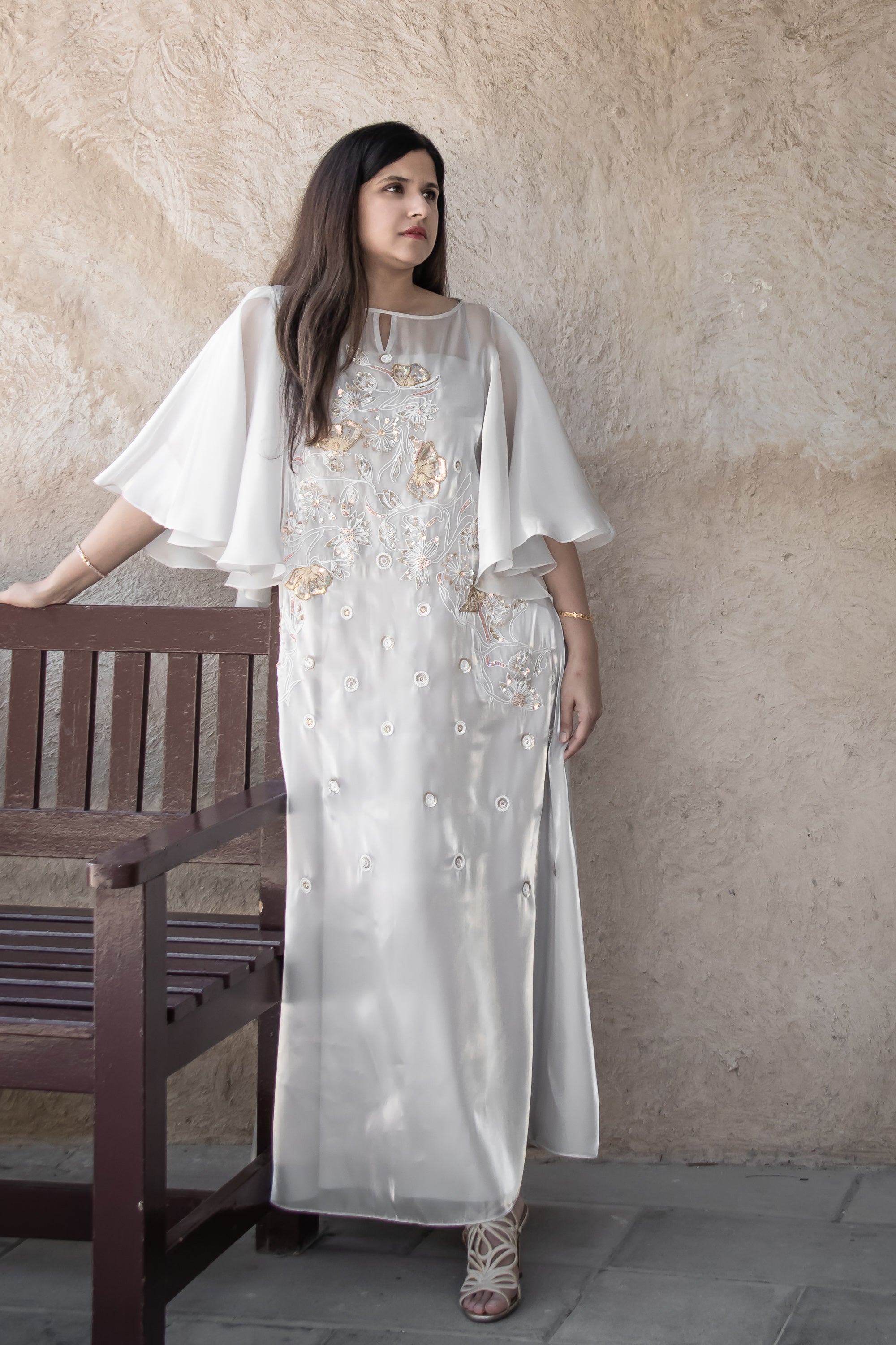 Avelyn Kaftan in flowing champagne organza with delicate floral beadwork for formal occasions
