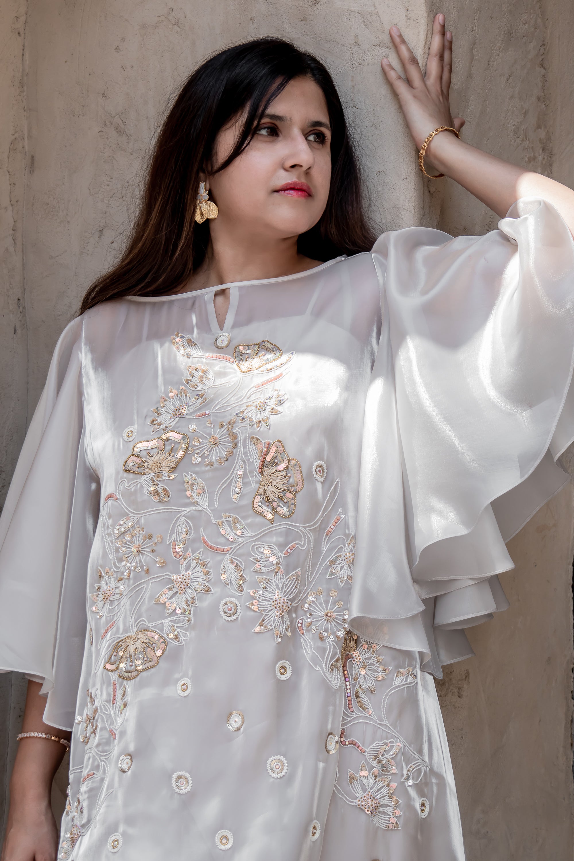 Soft champagne organza Avelyn Kaftan by Kunst featuring elegant draped layers and subtle shimmering bead details

