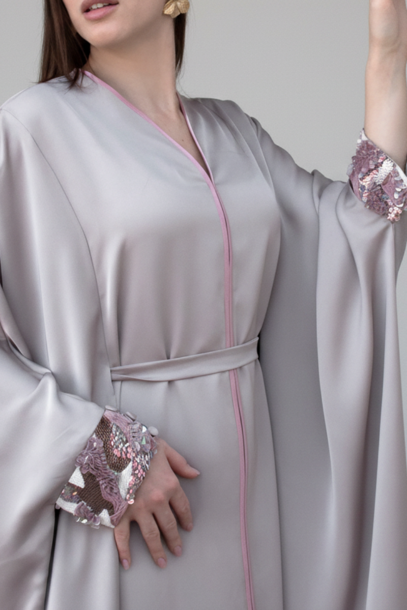 Amira Farasha open front thobe in soft pastel tones with sparkling pink sequin cuffs, luxury modest wear
