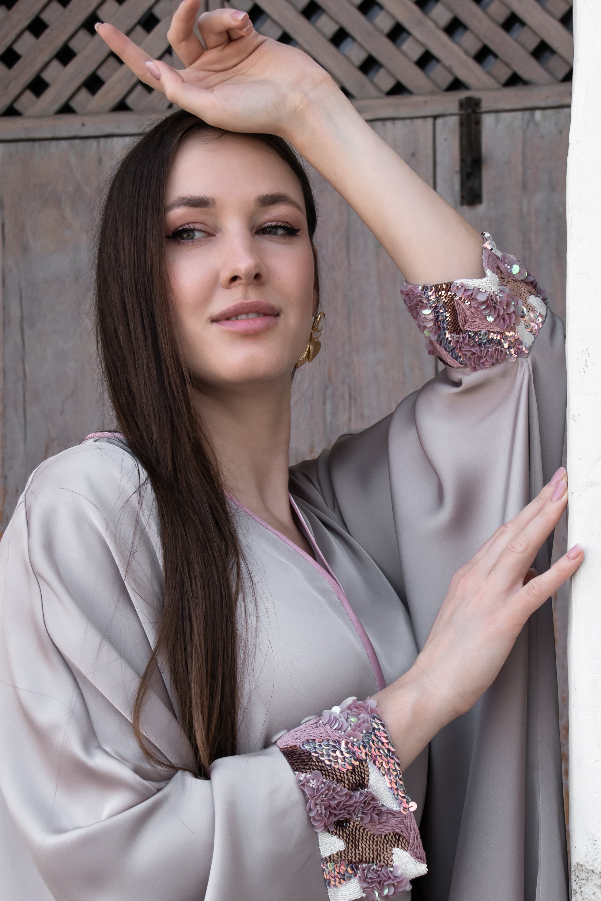 Kunst Open front Amira Farasha modest thobe showcasing flowing silhouette and bold pink sequin cuff details

