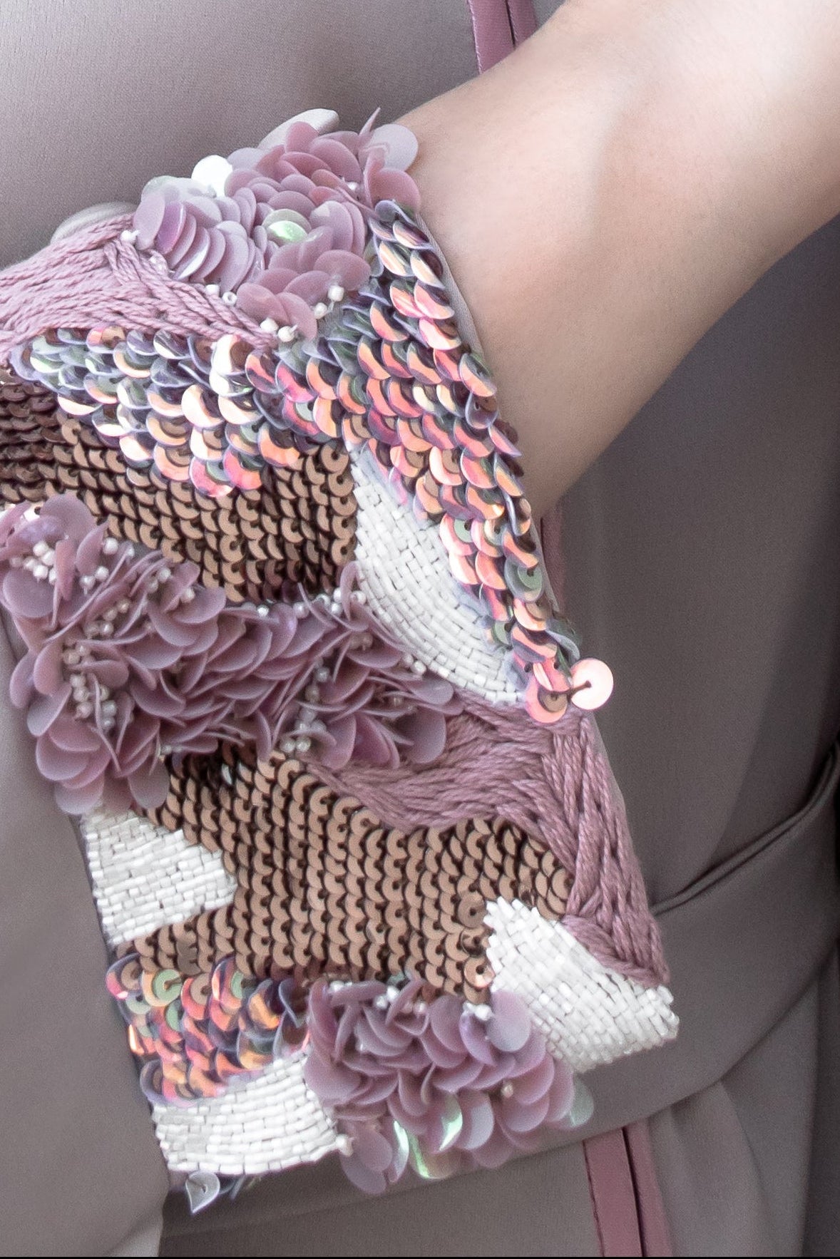 close up of Luxury pastel Amira Farasha thobe with contemporary open front style and glittering sequin cuffs
