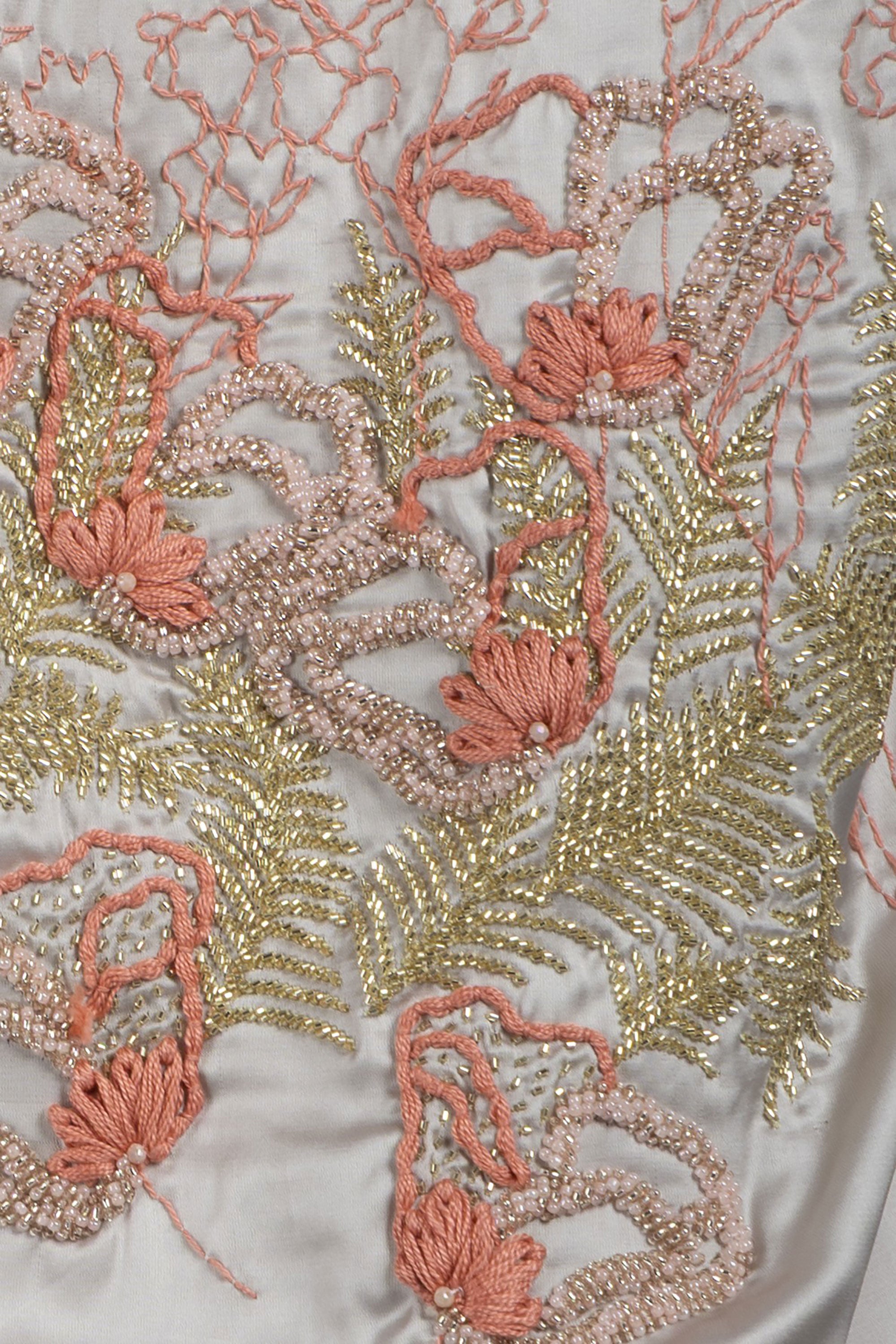 close up of Midi-calve silk shirt dress with embroidered floral detail on the back
