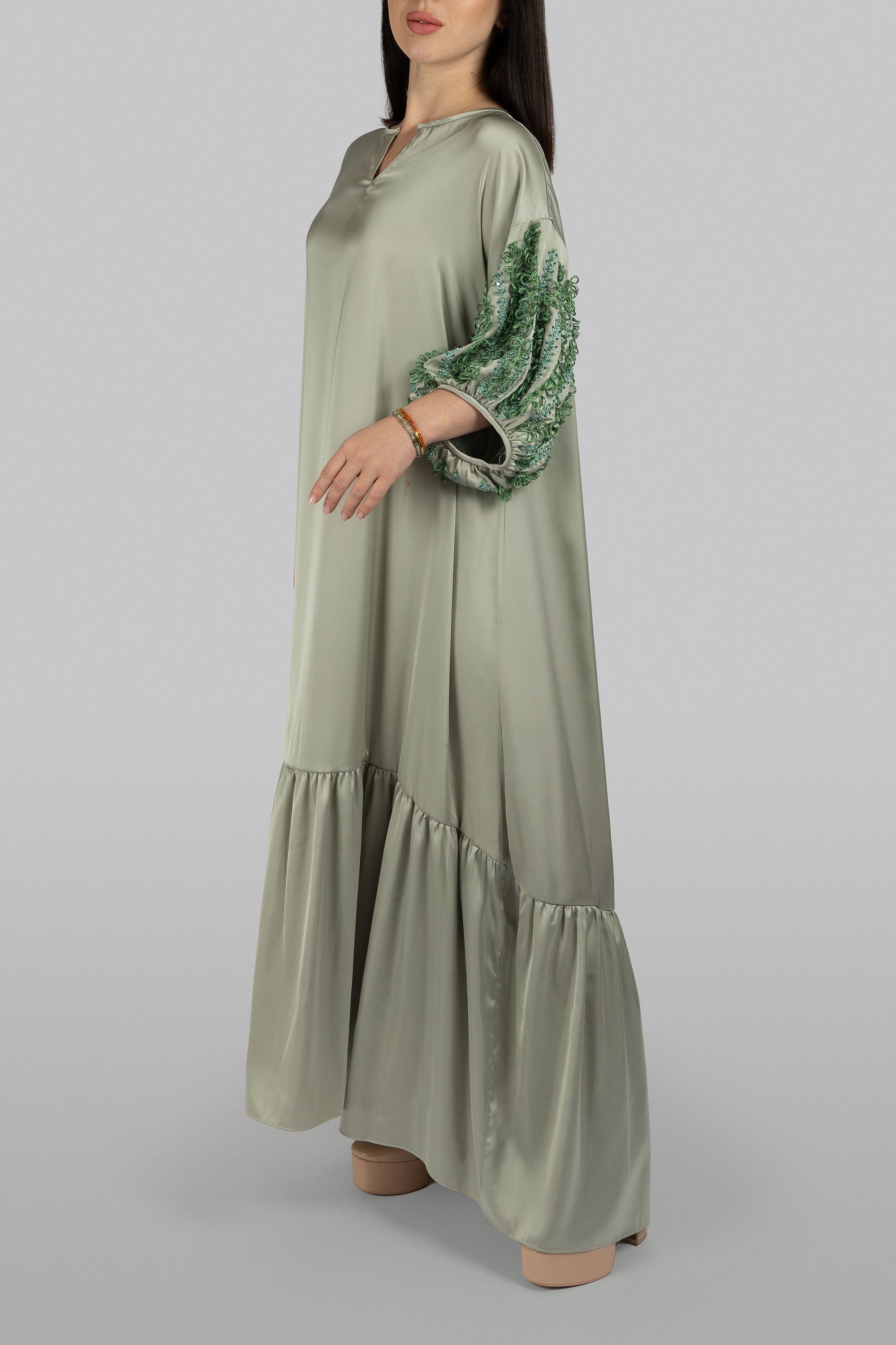 Smoke green satin maxi dress with crystal-studded abstract leaf motifs
