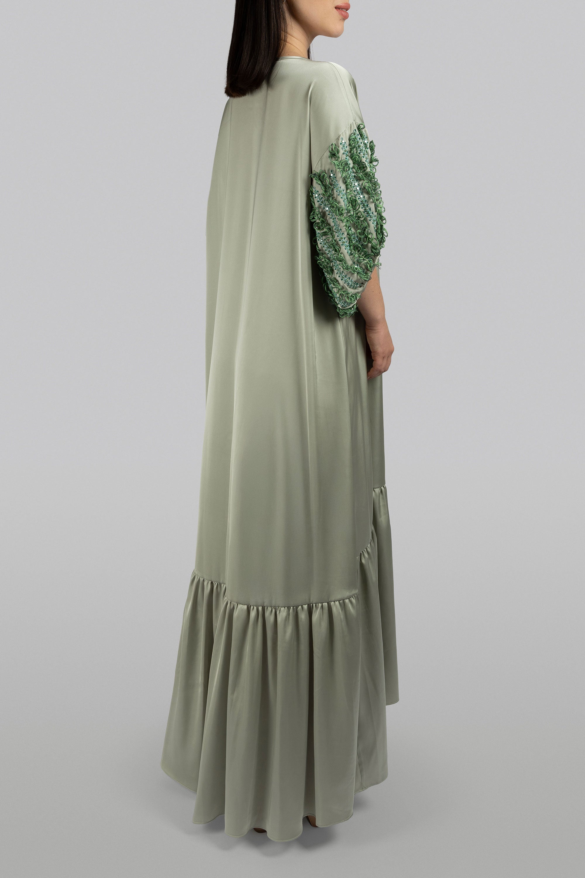 Fern dress with exaggerated sleeves and cascading threadwork
