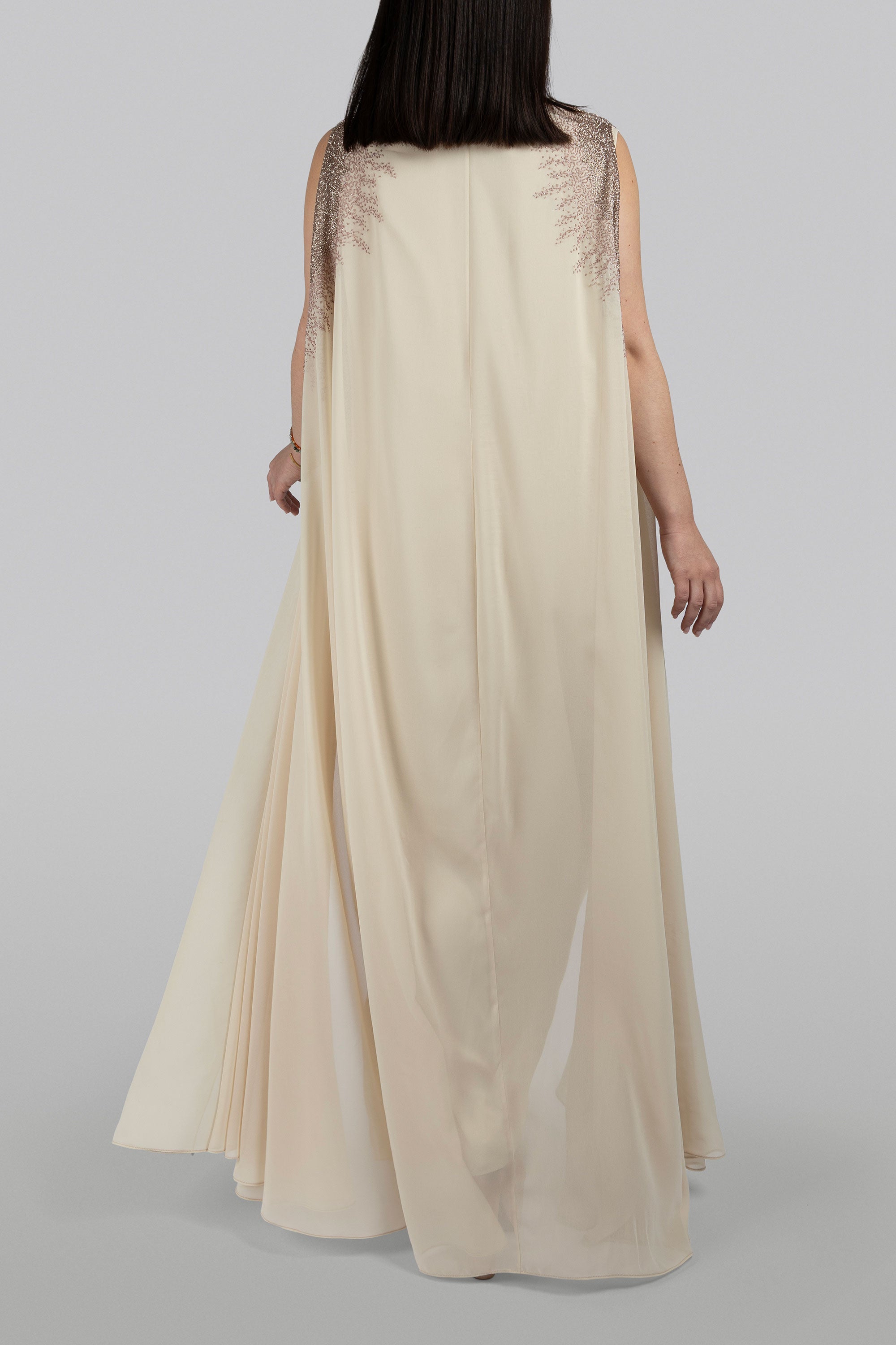 Back view of Thalia hand-embroidered chiffon cape showing fluid drape and beadwork by KUNST UAE
