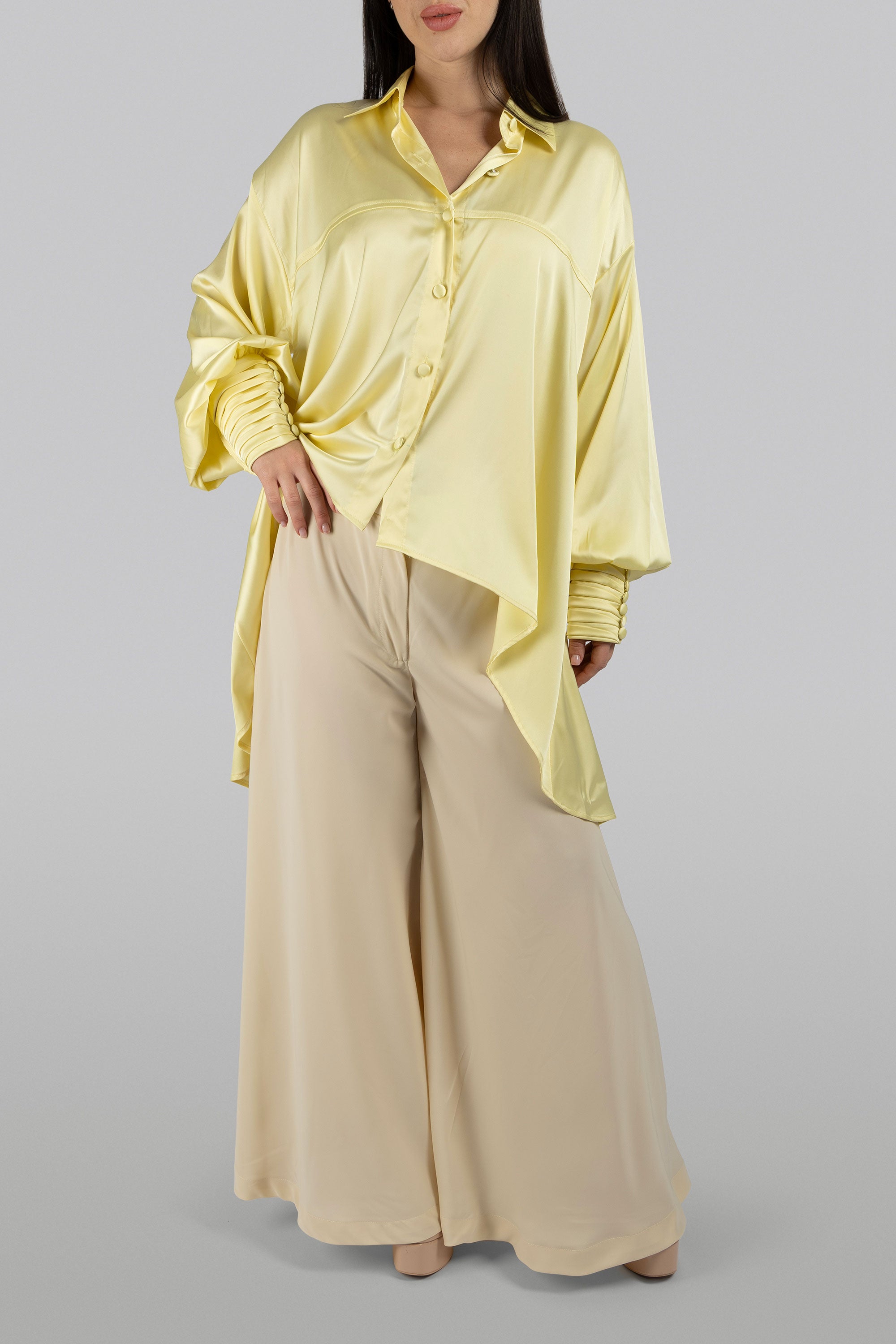 Luxury modest top with pleated cuffs and statement silhouette
