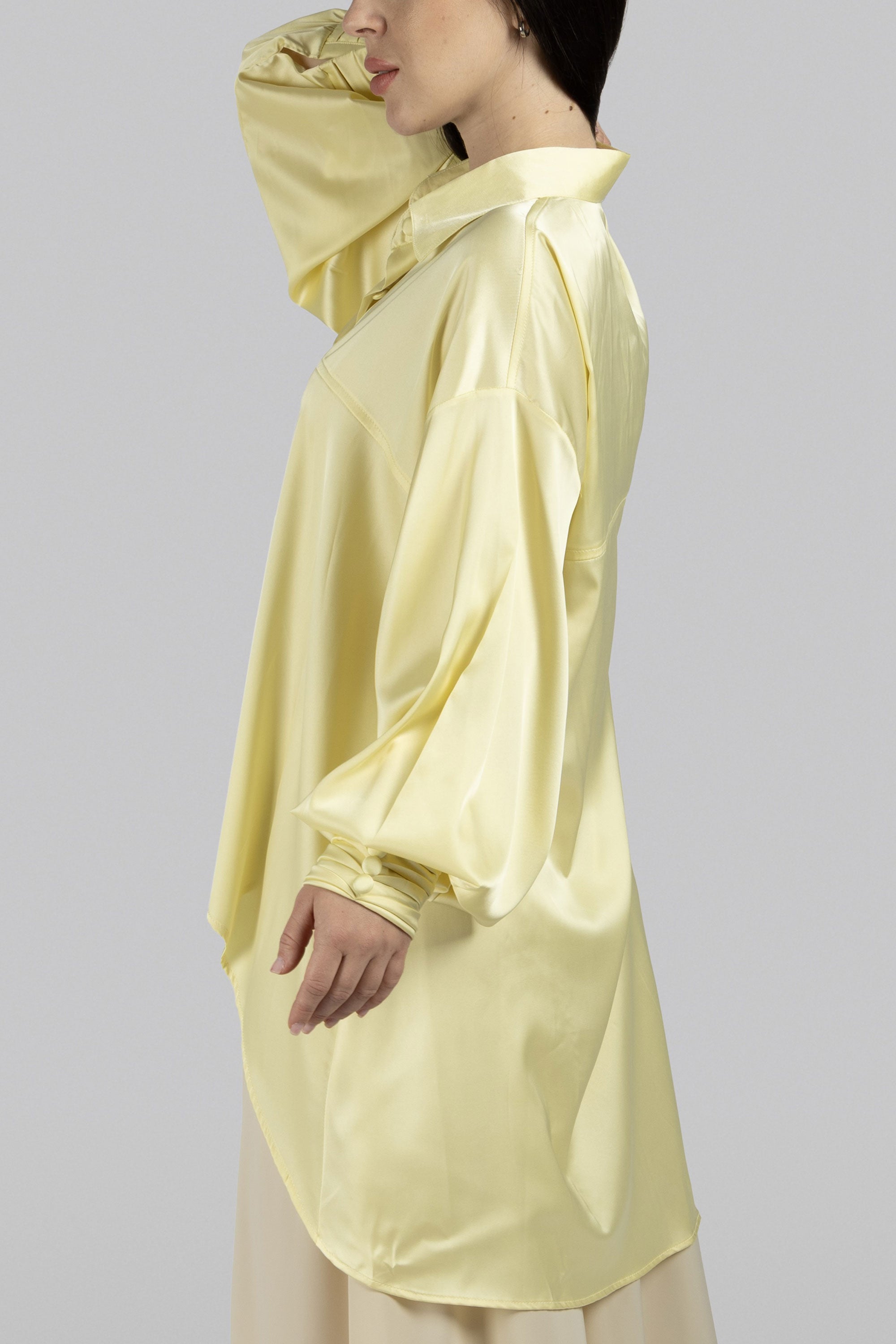 Opal asymmetric silk top with voluminous sleeves and refined details
