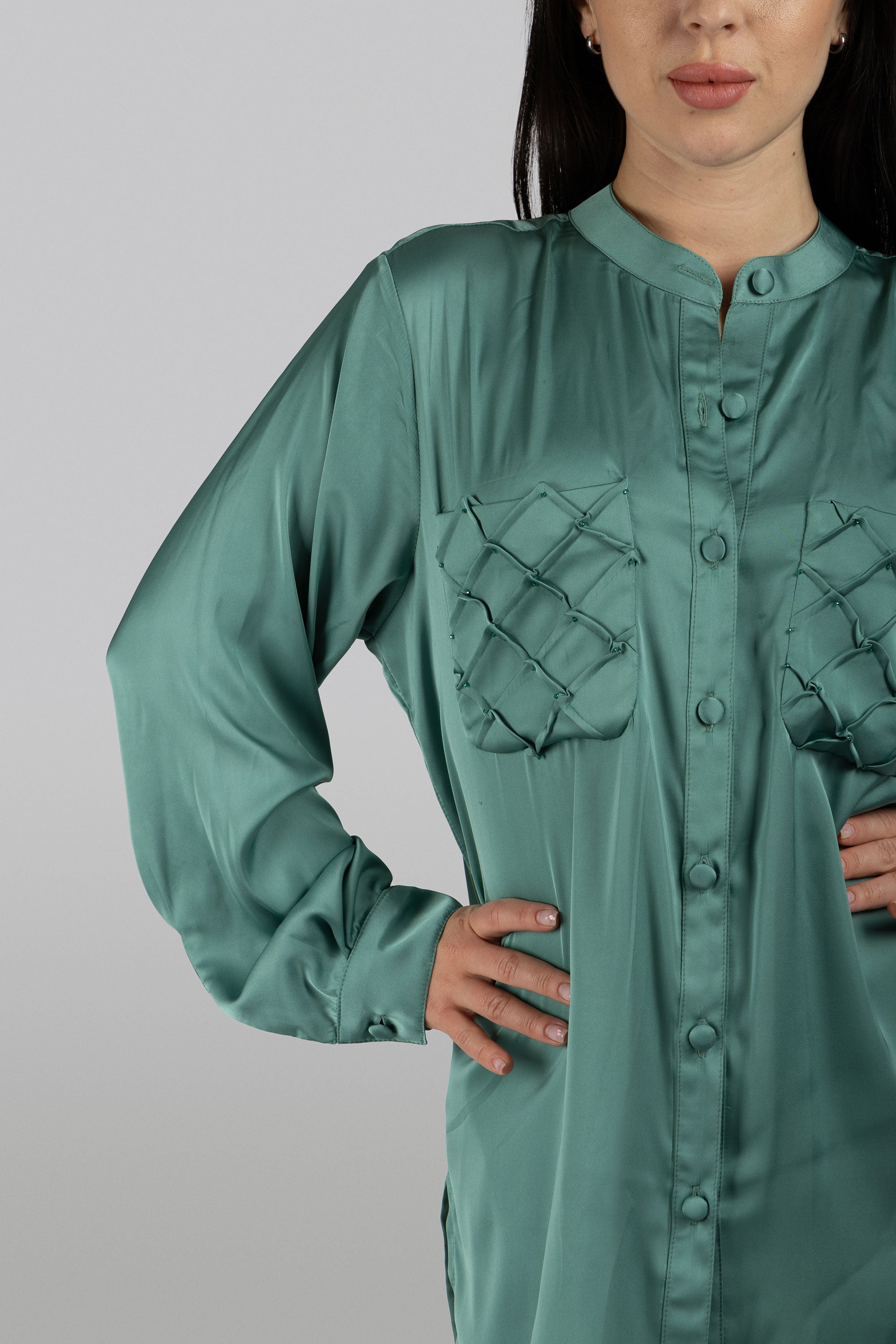 close up of Aqua green silk tunic for chic day-to-night styling
