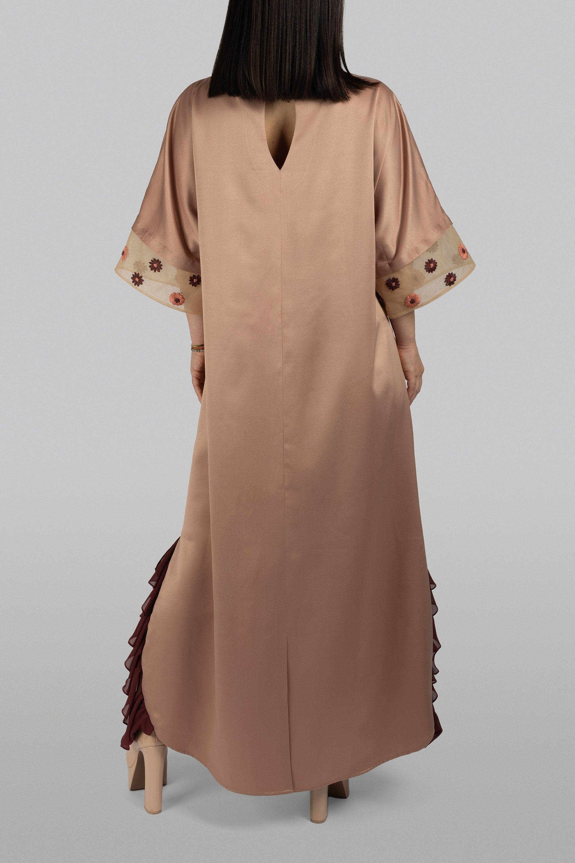 Floor-length satin dress with embroidery and frill accent