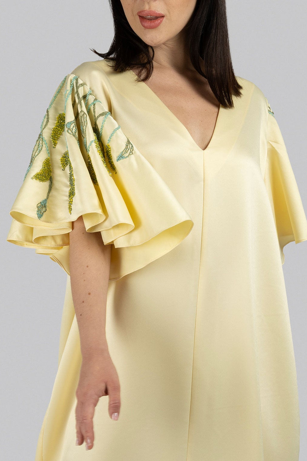 Butter-yellow chiffon caftan with delicate beadwork and flowing silhouette
