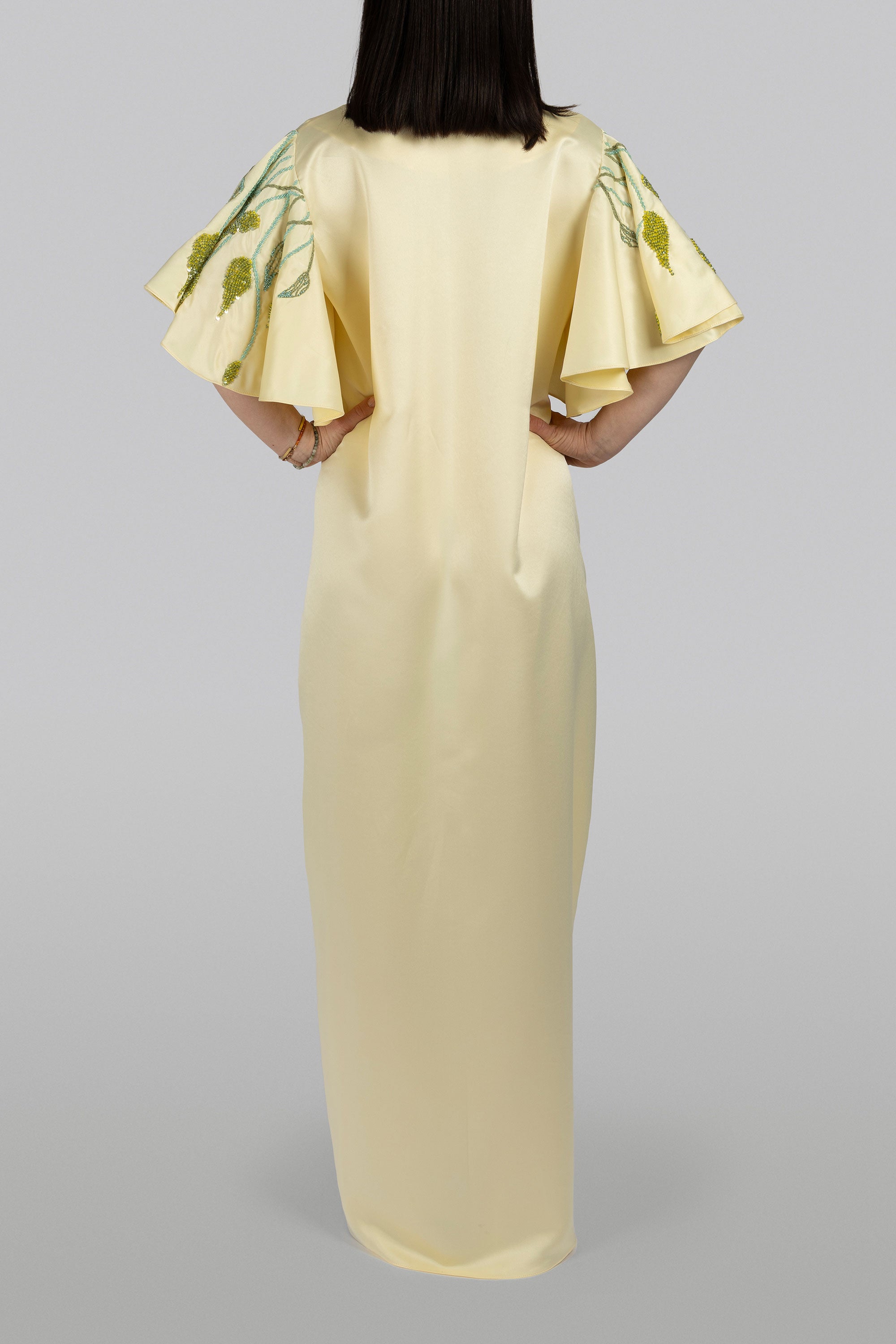 Wisteria caftan with exaggerated sleeves and green sequin leaf embroidery
