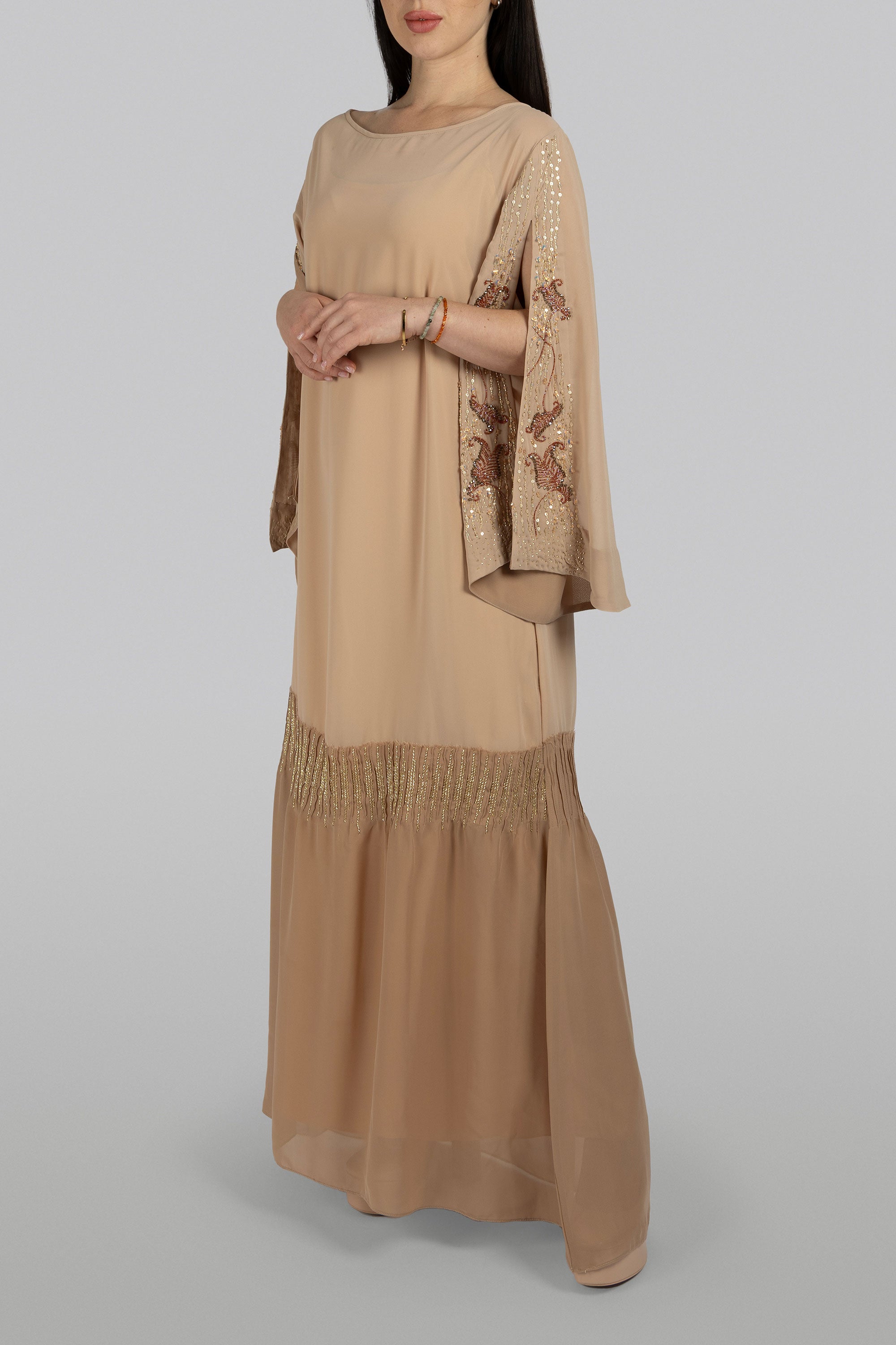 Tan chiffon caftan with flowing silhouette and embroidered sleeves