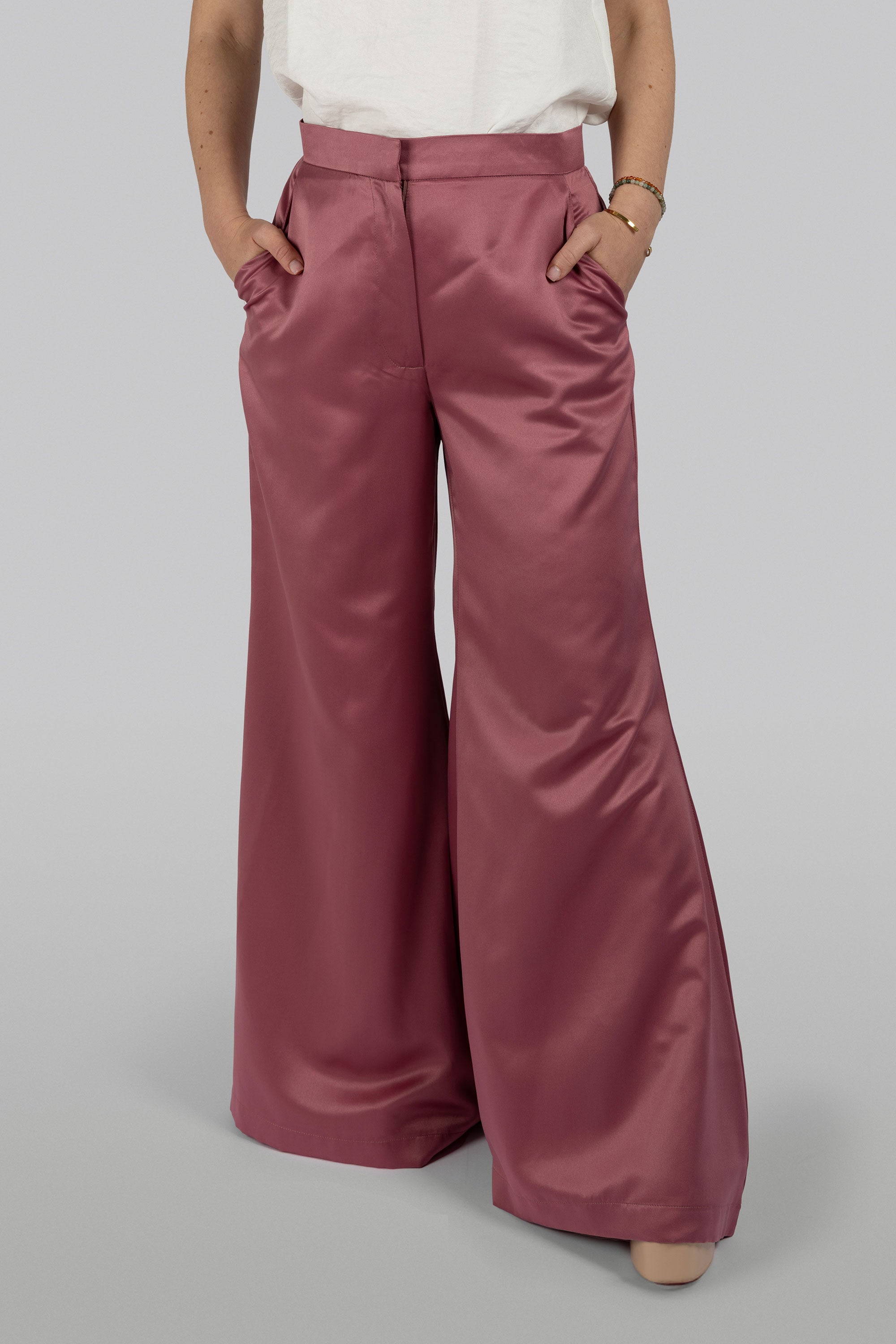 Flow blush satin flared pants with refined silhouette
